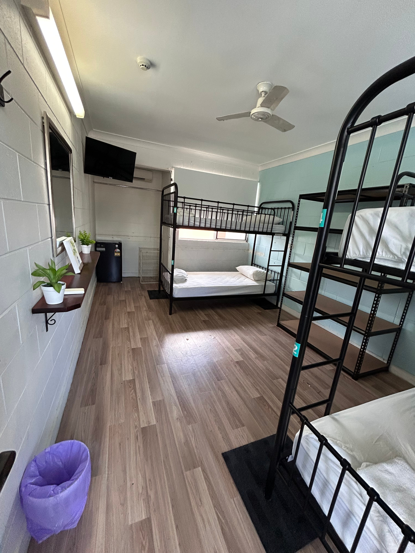 Seaside Lodge dorm room with TV